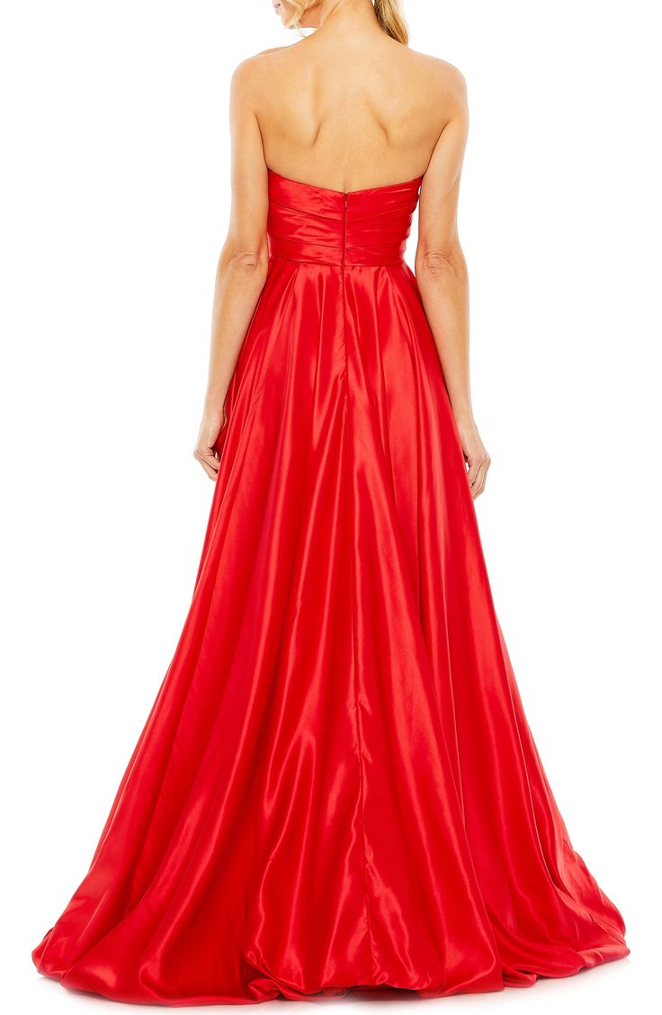 A satiny siren-shaded gown will cause a stir with a very swishy skirt and a strapless silhouette. 61" length Strapless Lined 100% polyester Spot clean Imported Asian Owned/Founded Evening A-line Gown With Satin Finish, Strapless Evening Ball Gown With Sweep Train, Strapless Ball Gown With Sweep Train For Evening, Glamorous Strapless Gown For Debutante Ball, Glamorous Satin Dress For Debutante Ball, Glamorous Satin Evening Dress For Debutante Ball, Satin Finish Full Length Evening Dress, Satin Strapless Ball Gown For Party, Sleeveless Satin Gown For Debutante Ball