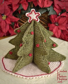 a crocheted christmas tree sitting on top of a table