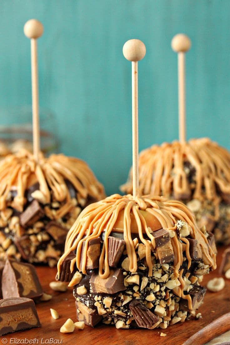 chocolate caramel pretzel pops with peanut butter drizzles on top