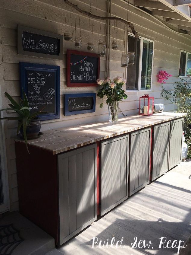 an outside bar with some flowers on it