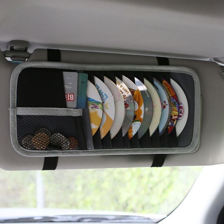 a bunch of surfboards are hanging from the back of a car's seat