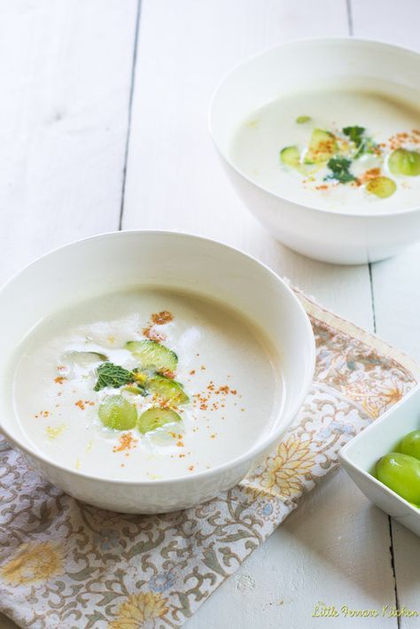 two white bowls filled with soup next to each other