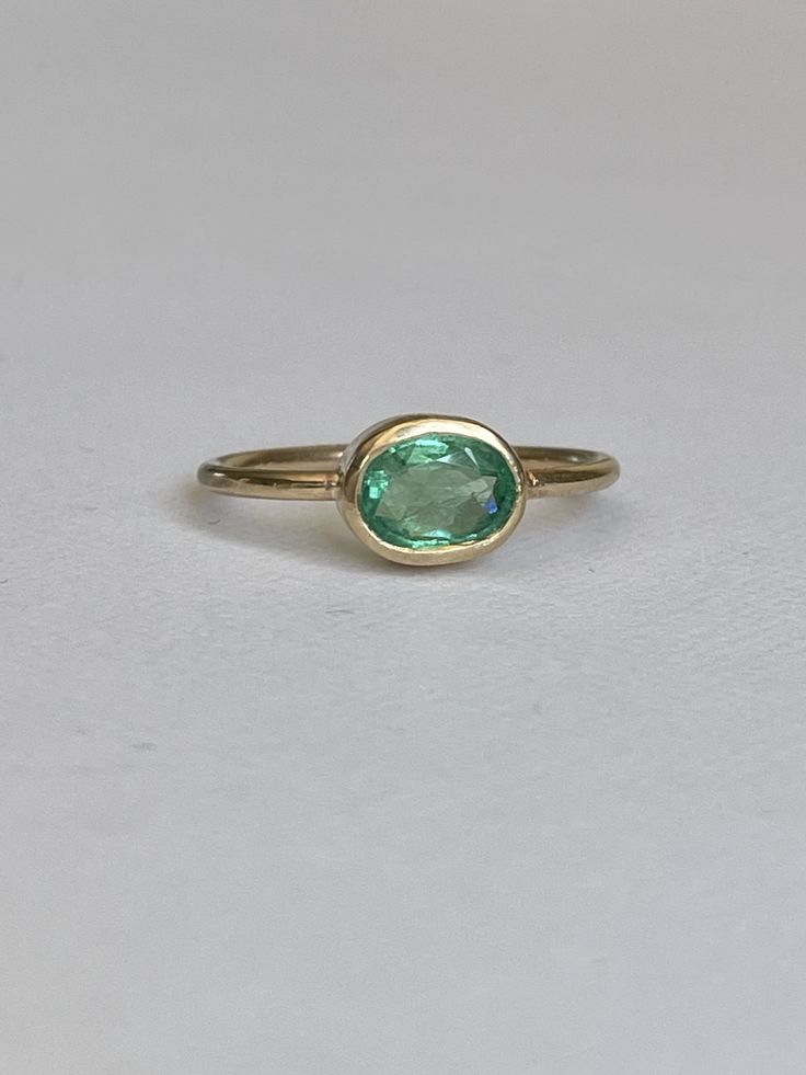 One of a kind, handmade apple green emerald ring. Stones: 1.0ct emerald Material: 9ct Solid Yellow Gold Size: M or 52mm circumference Rink Shank Width: 1,5mm Green Oval Sapphire Promise Ring, Green Emerald Ring With Bezel Setting, Oval Emerald Birthstone Ring In Fine Jewelry Style, Oval Emerald Ring In Gold, Fine Jewelry 14k Gold Green Emerald Ring, 14k Gold Green Emerald Ring, 14k Gold Green Emerald Ring, Fine Jewelry, Green Oval Ring With Bezel Setting, Green Oval Jewelry With Bezel Setting