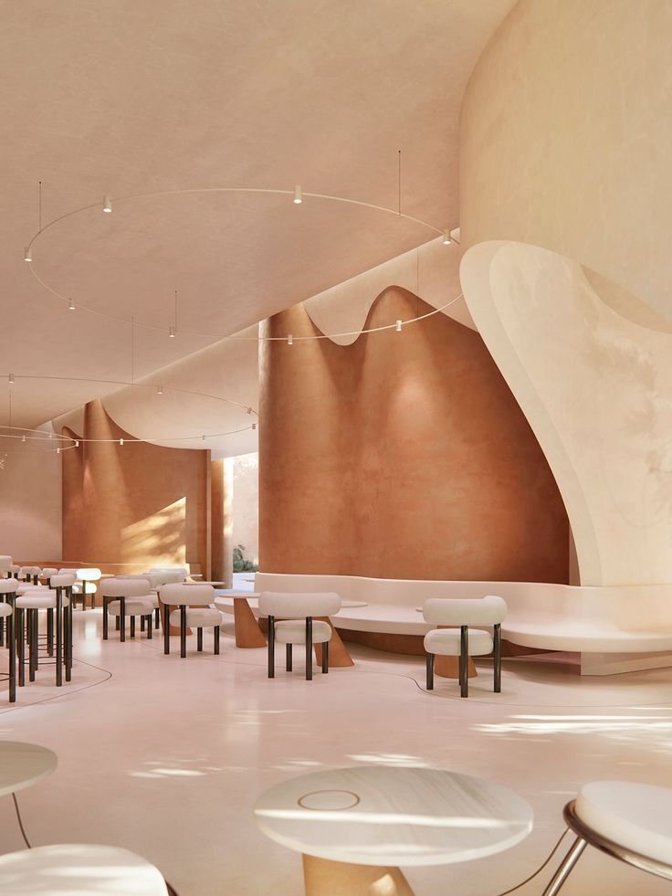 the interior of a restaurant with tables and stools in white, beige and brown colors