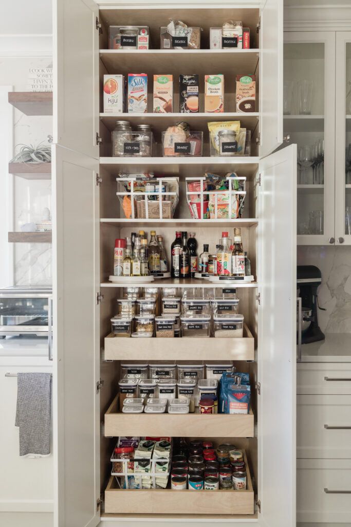 an organized pantry with lots of food in it