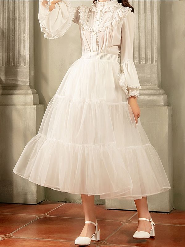 Elevate your outfit with the white 85cm daily A-line long layered petticoat. This versatile petticoat adds volume and dimension to your favorite skirts and dresses, creating a stunning A-line silhouette. The 85cm length provides ample coverage and the layered design adds a touch of whimsy to your look.  Please note that this product includes only the petticoat.  Garment Size   	 		 			Size 			Free Size 		 		 			Full Length 			85 		 		 			Waist 			58-90 Spring Dress With Full Skirt In Structured Fabric, White Ruffled Skirted Petticoat, Spring Crinoline Dress With Full Skirt, Spring Full Skirt Crinoline Petticoat, Voluminous Skirted Petticoat With Ruffles, White Balletcore Skirt With Ruffles, White Flowy Ruffled Petticoat, White Ruffled Petticoat With Flowy Fit, White Tiered Skirt Dress With Attached Cancan