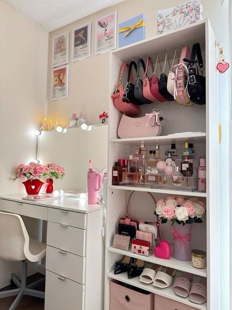 a white desk topped with lots of pink purses and shoes on top of it