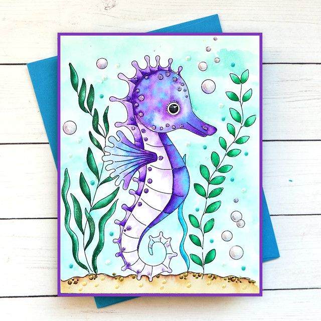 a card with an image of a sea horse