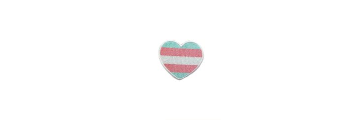 a pink and blue striped heart shaped object on a white background with the word love written across it