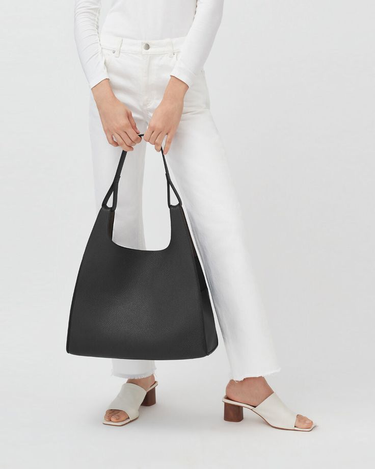 A modern and unique marriage of the classic shoulder bag and the quotidian shopping bag, with a soft structure, to elegantly accompany you through everyday activities. Small Leather Accessories, Modern Handbag, Leather Industry, Line Shopping, Zippered Tote, Soft Tops, Shopping Tote, Soft Suede, Pisa