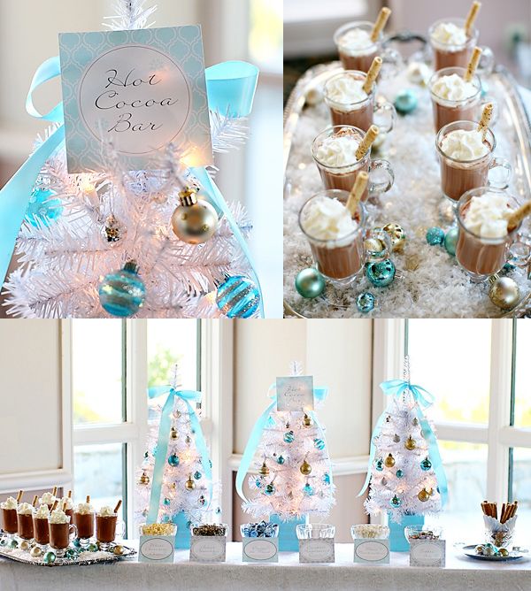 a table topped with desserts and cups filled with frosted drinks next to a christmas tree