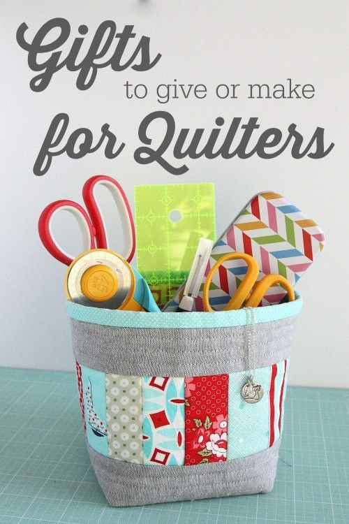 a basket filled with scissors and other crafting supplies sitting on top of a table