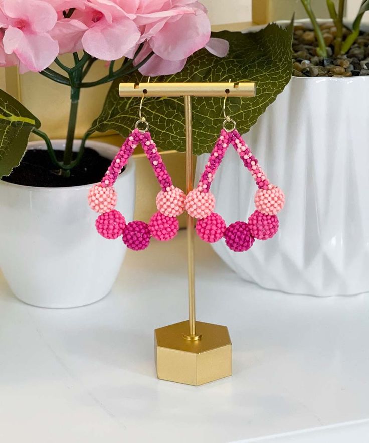 Introducing our enchanting "Just Swing" Earrings in a lovely shade of pink, the perfect accessory to add a touch of whimsy and charm to your ensemble. Crafted with precision, these Seed Bead Ball Teardrop Earrings feature a delightful design that exudes elegance and playfulness.
Measuring 2.5 inches in length, these earrings showcase a graceful teardrop shape adorned with intricate seed bead balls in a beautiful pink hue. The lightweight fish hook design ensures easy and comfortable wear, allowing you to swing and sway with confidence wherever you go.
Whether you're dressing up for a special occasion or adding a pop of color to your everyday look, these "Just Swing" Earrings are sure to turn heads and spark conversation. Let your personality shine as you accessorize with these charming and Pink Dangle Chandelier Earrings As Gift, Pink Chandelier Earrings For Summer Party, Pink Hoop Earrings With Dangling Beads For Gift, Pink Chandelier Drop Earrings For Gift, Pink Chandelier Earrings For Gift, Handmade Pink Beaded Earrings For Party, Pink Beaded Drop Crystal Earrings, Pink Round Beaded Earrings With Dangling Beads, Pink Beaded Crystal Drop Earrings