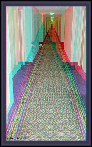 an image of a long hallway that looks like it is going down the hill in color