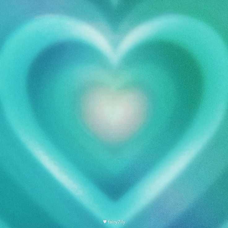 a blurry image of a heart in blue and green colors with an abstract background