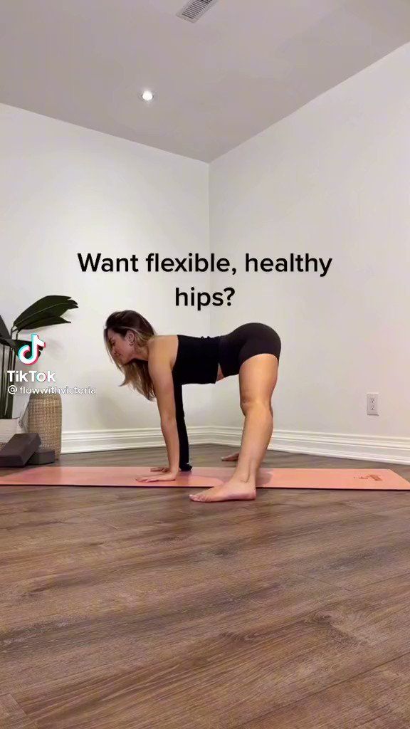 a woman is doing yoga on a mat with the words want flexible, healthy hips?