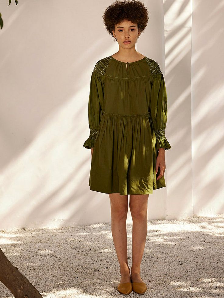 A sap green cotton poplin dress with front single button opening and side seam pockets. The tiered dress comes with smocking detailing at the sleeve hem and along the shoulder. Sap Green, Cotton Poplin Dress, Spring Breeze, Poplin Dress, Green Midi Dress, Tiered Dress, Green Fabric, Green Cotton, Aza Fashion