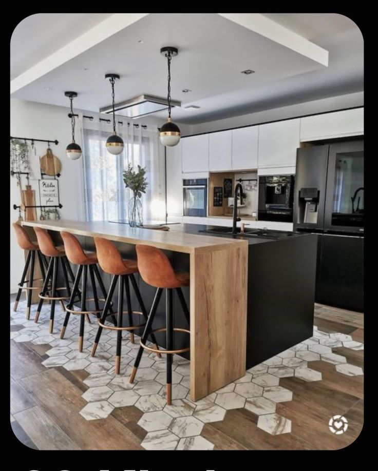 an image of a kitchen setting with bar stools and island in the middle that is decorated with hexagonal tiles