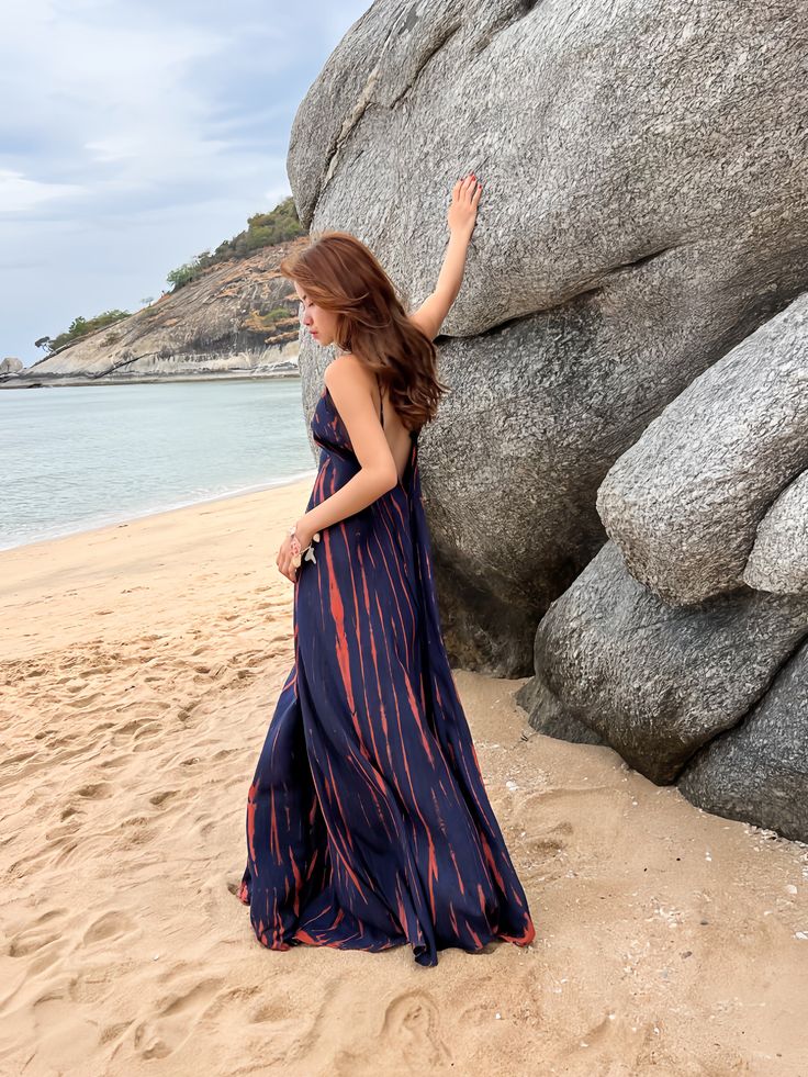 Our Nomad Tie-Dye Maxi Dress is a timeless classic, showcasing an elegant blend of boho style and wearability. Made from lightweight rayon fabric, this A-line piece is designed to flatter the figure, with alluring tie-dye hues and a cascading, ankle-skimming hemline. A V-neckline and an open back, secured with a tie closure, complete the look - perfect for a romantic getaway, paired with a straw hat and sandals. Features: Floor-length maxi dress Rayon fabric stays cool and airy Unlined for unmat Casual A-line Rayon Maxi Dress, A-line Rayon Dress For Vacation, Bohemian A-line Maxi Dress For Beach Season, Bohemian Maxi Beach Dress In Rayon, Bohemian Rayon Maxi Beach Dress, Bohemian Rayon V-neck Sundress, Bohemian Blue A-line Maxi Dress, Bohemian A-line Beach Maxi Dress, Beach Sundress In Rayon With Maxi Length