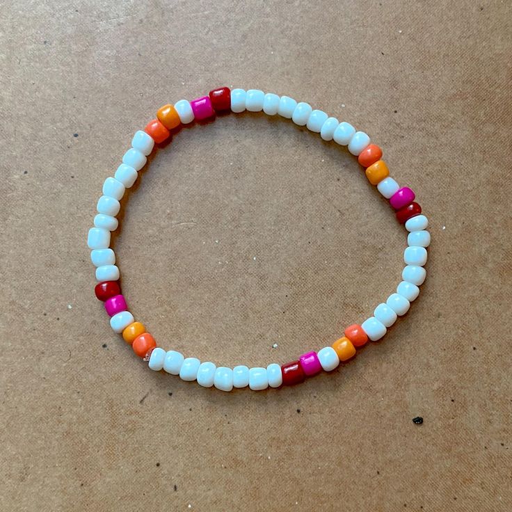 White pearl bracelet with lesbian rainbow pride flag to show your LGBTQ pride. Size S. The other flags are in my shop! Bi Bracelet, Les Fashion, Rainbow Pride Flag, White Pearl Bracelet, Rainbow Flag Pride, Lesbian Flag, Lgbtq Pride, Pride Flag, Rainbow Pride