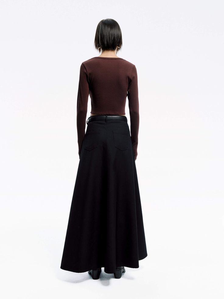 MO&Co. Women's Wool Blend Maxi Skirt A transitional wardrobe staple, this knitted midi skirt is crafted from a wool blend, lending the knit a subtle sheen. It features a high waist and inner inverted pleats at the front that create a graceful, flowing hem. Perfectly paired with our matching top for a chic and coordinated look. Please note, the waist belt is not included. Features : - High waist A-line maxi silhouette- Side pockets, front inner pleats- Button and zip closure Code: MBD1SKT034The back length of size S is 99cmMATERIALS & CARE Material: 71% Polyester 29% WoolPlease put it into a mesh bag to wash.REMINDER: All items are measured manually. Please note that it's reasonable that there might be minor measurement differences (1-2cm) on some items. Fitted Maxi Skirt For Fall Workwear, Evening Pleated Flared Skirt For Fall, Wool Maxi Skirt For Fall Workwear, Fall Asymmetrical Pleated Skirt For Workwear, Modern Asymmetrical Skirt For Fall, Asymmetrical Maxi Skirt For Work In Fall, Wool Flared Maxi Skirt For Work, Asymmetrical Pleated Skirt For Fall Workwear, Fall Workwear Asymmetrical Pleated Skirt