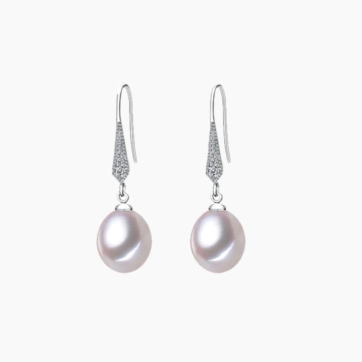 The Pearl 925 Silver Drop Earrings epitomize sophistication and grace with their timeless design and exquisite craftsmanship. These earrings marry the natural elegance of pearls with the lustrous beauty of sterling silver, creating a harmonious union of classic and contemporary style. Minimalist Pearl White Pearl Earrings For Formal Occasions, Minimalist Pearl White Formal Pearl Earrings, Elegant Silver Akoya Pearl Earrings, Formal Minimalist Pearl White Earrings, Formal White Gold Minimalist Pearl Earrings, Formal Minimalist White Gold Pearl Earrings, Silver Akoya Pearl Earrings With Pearl Charm, Formal Teardrop Earrings With Pearl Charm, Silver Akoya Pearl Dangle Earrings