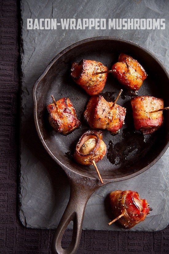 bacon wrapped mushrooms in a cast iron skillet