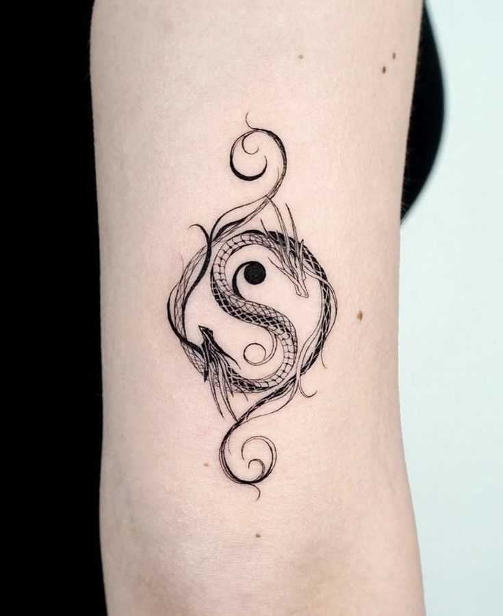 a woman's arm with a tattoo design on the left side of her body