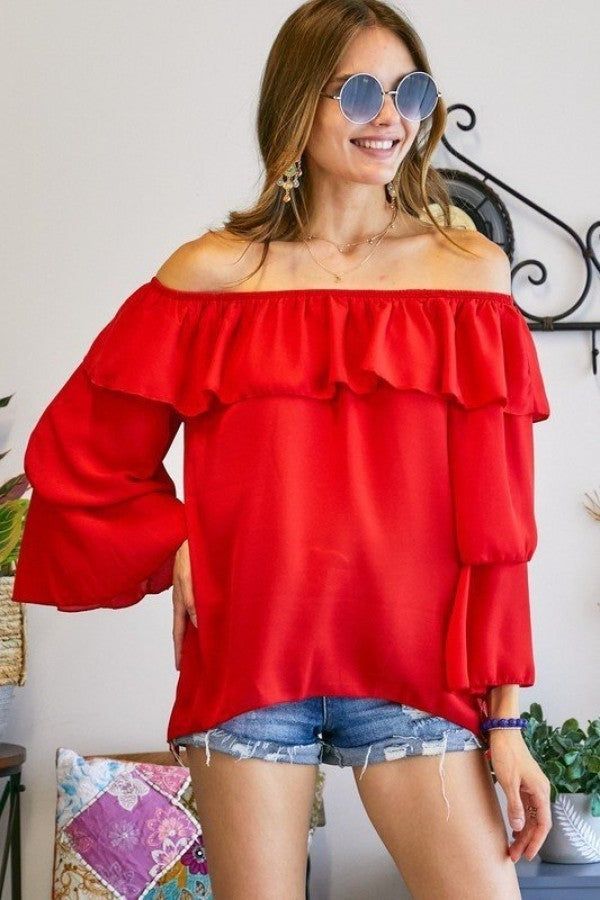 The Black Off The Shoulder Top can be styled with shorts, jeans, pants or just about anything! Description: TRIPLE LAYERED BELL-SLEEVE OFF SHOULDER TOP100% POLYESTER. MADE IN USA.Category: Bella Chic Tops & TeesFabric: 100% POLYESTER.Made In: USA Flirty Off-shoulder Tops For Brunch, Flirty Off-shoulder Top For Date Night, Red Ruffle Tops For Brunch, Red Ruffled Tops For Brunch, Long Sleeve Flirty Top For Summer, Flirty Long Sleeve Tops For Summer, Flirty Long Sleeve Summer Top, Flirty Red Top With Ruffles, Casual Red Off-shoulder Top