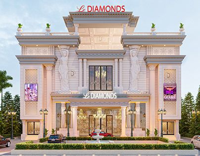 the front of a diamond's store lit up at night with cars parked outside