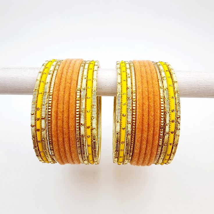 Beautifully designed bangles for any occasion. South asian bracelets come in a variety of styles, colors, and finishes. We at Banglez take creating the perfect bangle set for you to another level! You could say helping you find your favorite stack of bangles as one of our greatest missions. This bangle set was curated in house by one of our talented team members. We hope you love them as much as we do! Adjustable Yellow Round Bangle, Adjustable Round Cuff Bracelet For Festive Occasion, Orange Bracelet For Festivals As Gift, Bohemian Orange Bangle Jewelry, Orange Bracelets For Festivals Gift, Orange Bracelets As Festival Gifts, Orange Bohemian Bangle Jewelry, Orange Festival Bracelet As Gift, Festive Handmade Yellow Bracelets