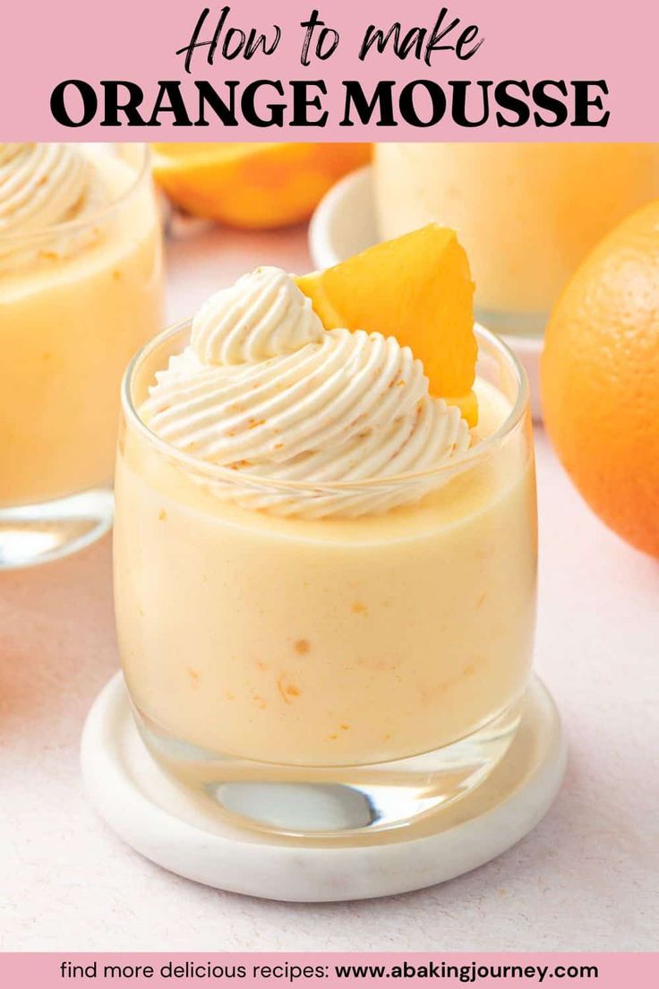 an orange mousse is garnished with whipped cream and a slice of orange