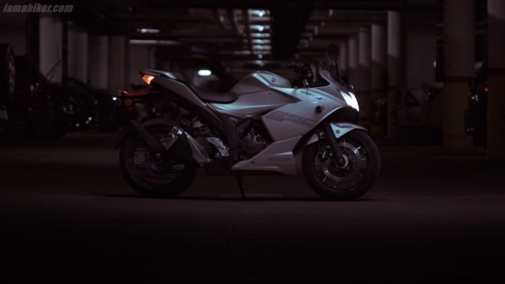 a motorcycle parked in a parking garage at night