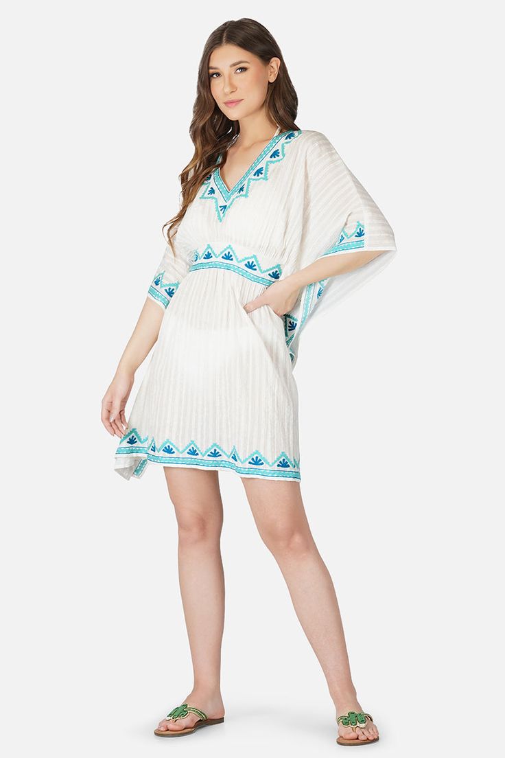 Cute as a button, retro like lyrics, made for a day out in the sun, the Sea Blue Embroidered Kaftan loves long drives, Sunday brunches and lots of pictures. Featuring intricate hand embroidery in shades of blue, a V neckline, elastic waist and an above knee length, this cutie will take you through tropical vacations and swim trips alike. On a neutral white with lurex stripes, the blue hand embroidery really powers through and reminds us of a calm blue sea. Style with happy jewels, a pair of flat Blue Hand Embroidery, Sea Style, Embroidered Kaftan, Long Drives, Tropical Vacations, Leopard Bag, Cute As A Button, Long Drive, Blue Hand