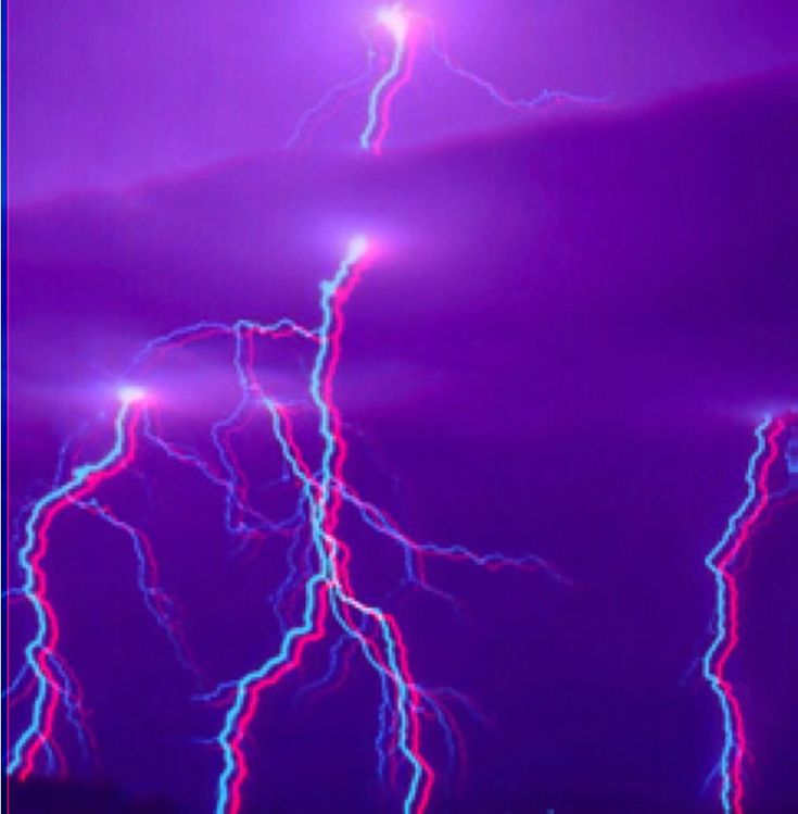 lightning strikes in the night sky with bright blue and pink lights