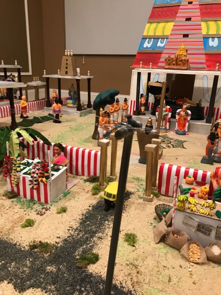 a toy train set is shown in the middle of a play area