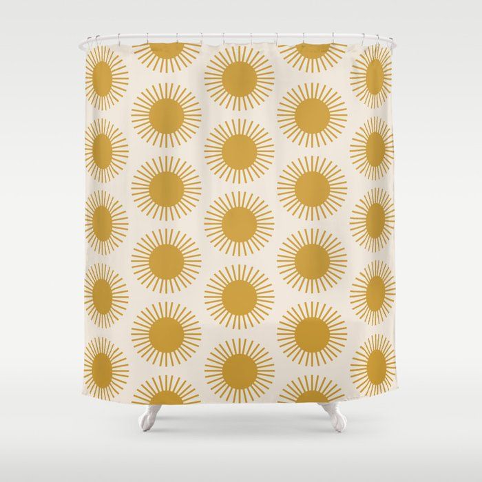 a shower curtain with yellow sunbursts on it