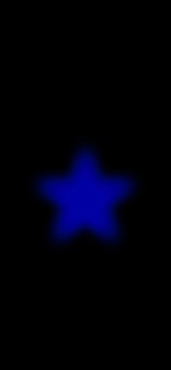 an image of a blue star in the dark