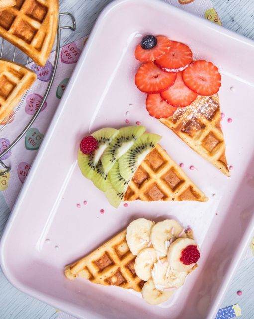 some waffles and fruit are on a plate