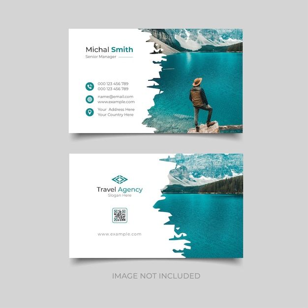 two business cards with the image of a man standing on a rock in front of water