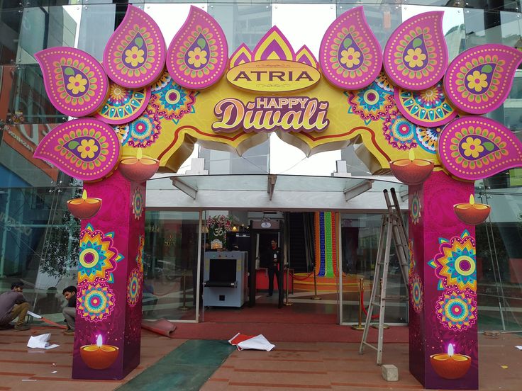 an entrance to a building decorated with bright colors and decorations for diwali festival