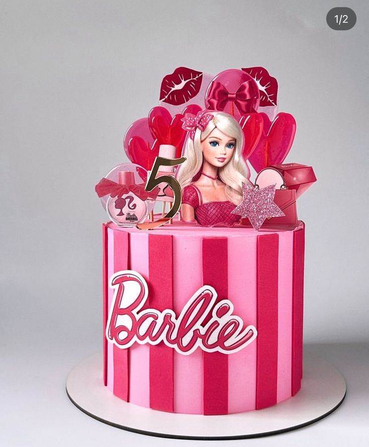 a barbie birthday cake with pink and red decorations