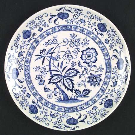 a blue and white plate with flowers on it