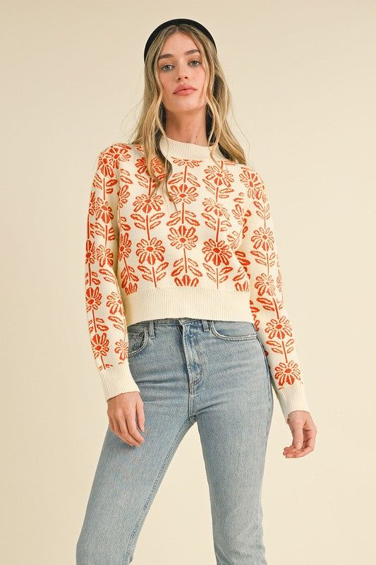 Dive right into effortless style with our Floral Pattern Knit Sweater. The ribbed high round neckline, hem, and cuffs add a touch of sophistication to this comfortable pullover. Perfect for staying cozy during the colder months, while still looking chic. Get ready to bloom in this fun, floral design! Fit: TTS Fabric: 50% Viscose, 30% Acrylic, 20% Polyester Crew Neck Cropped Sweater With Ribbed Cuffs For Fall, Spring Crew Neck Cropped Sweater, Spring Layering Cropped Sweater With Crew Neck, Spring Crew Neck Cropped Sweater For Layering, Spring Cropped Crew Neck Sweater For Layering, Crew Neck Cropped Sweater For Spring Layering, Fall Cropped Sweater With Textured Knit And Crew Neck, Spring Knit Sweater With Ribbed Neckline, Knit Sweater With Ribbed Neckline For Spring