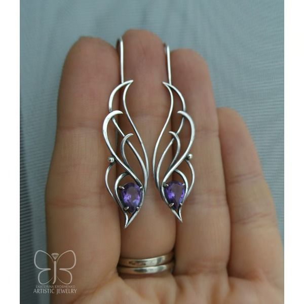 Item description from the seller    Amethyst silver earrings elven style. Charming bright amethyst in sterling silver. Completely handmade.  To order, I can make a pendant or ring to these earrings.    Silver earrings can be a great gift to your wife, daughter, mother, sister!     *** *** *** *** ***  All pieces are sent in a gift box! You do not have to think about the packaging of Your gift;    The product is patinated and polished.  _______________________  silver, amethyst  Length: 5 cm (1.97 inch)  Weigh Colorful Silver Jewelry, Elven Design, Hammered Metal Jewelry, Elven Style, Wire Butterfly, Silver Wire Jewelry, Wire Jewelry Earrings, Leather Jewelry Making, Wire Jewelry Patterns