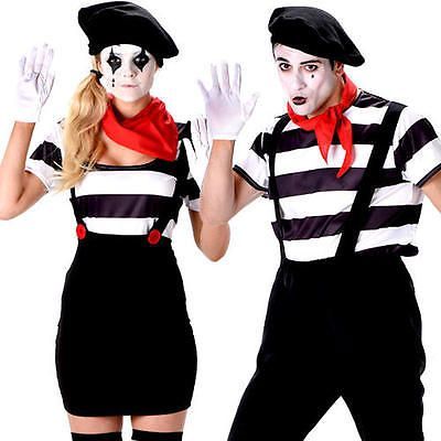 two people dressed in costumes and makeup