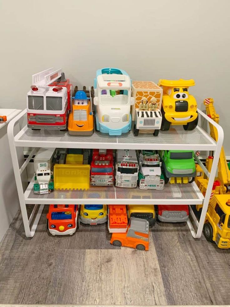 toy cars and trucks are stacked on top of each other in this playroom area