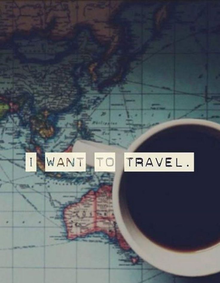 a coffee cup sitting on top of a map with the words i want to travel