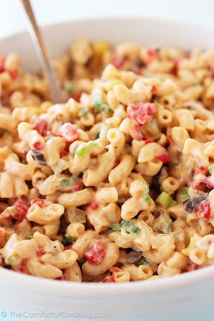 a white bowl filled with macaroni salad