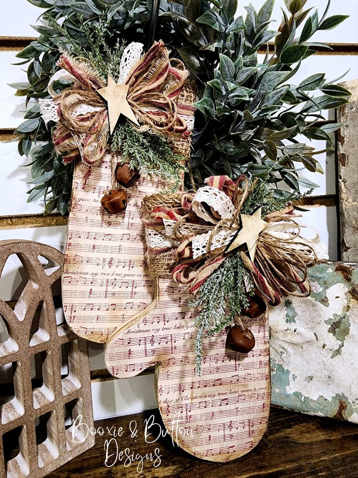 a christmas stocking hanging on the side of a wooden bench with holly and star decorations